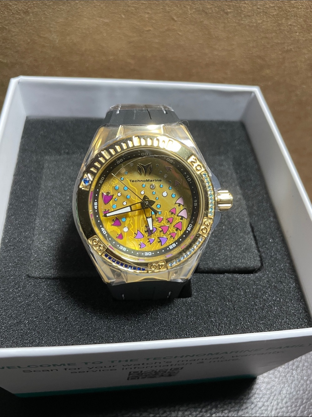 Technomarine Gold Dial Watch with Pink and Blue Accents BY INVICTA